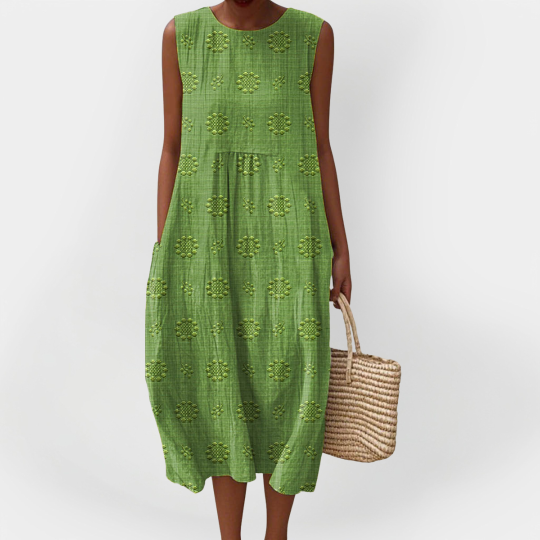 Elegantna brezrokavna bombažna obleka z žepi