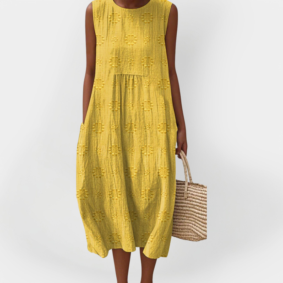 Elegantna brezrokavna bombažna obleka z žepi