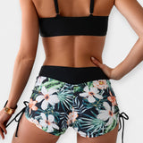 Bikini z visokim pasom s tropskimi motivi