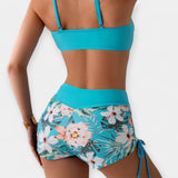 Bikini z visokim pasom s tropskimi motivi