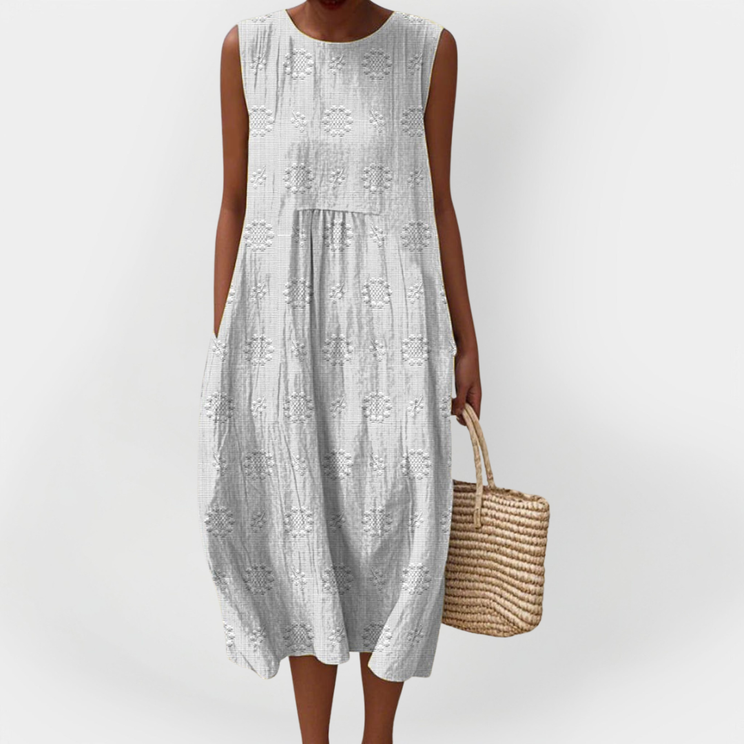 Elegantna brezrokavna bombažna obleka z žepi